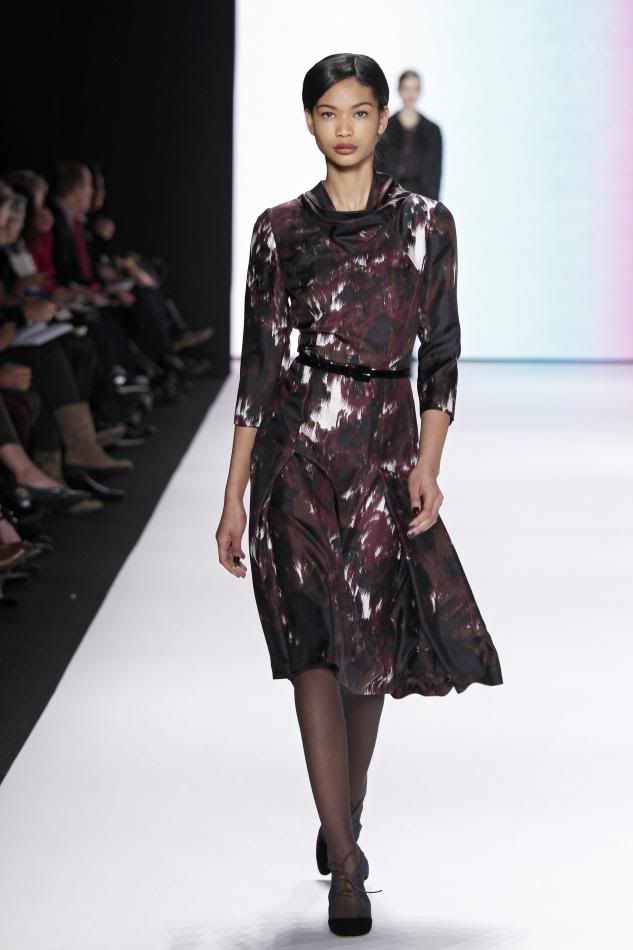 14. Chanel: Amethyst, cocoa, and bone abstract waterfall print silk crêpe cowl neck dress and cocoa velvet belt