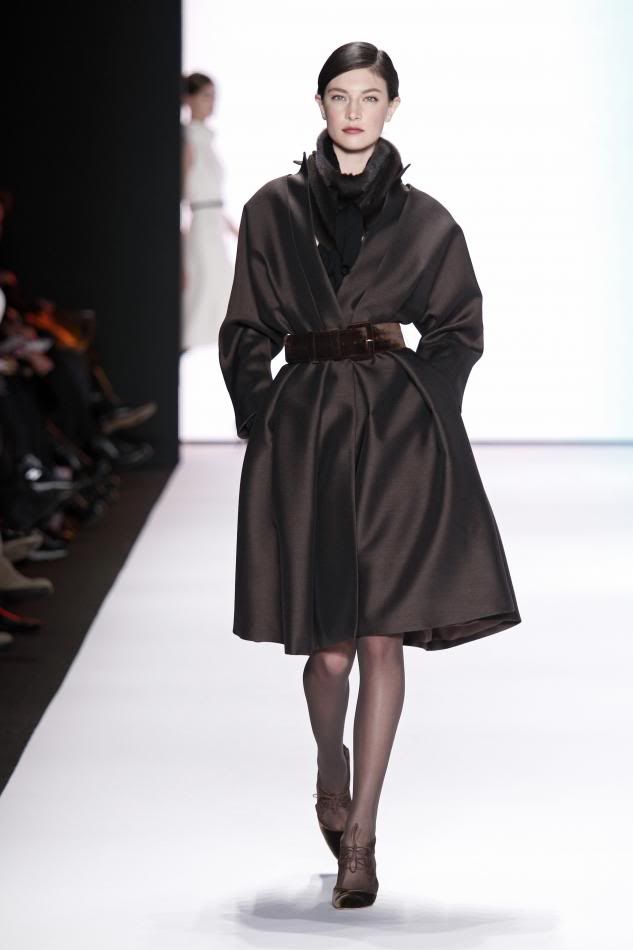 18. Jacqelin: Cocoa silk and wool organdy coat dress, ranch mink scarf, cocoa velvet belt, cocoa embroidered gloves.