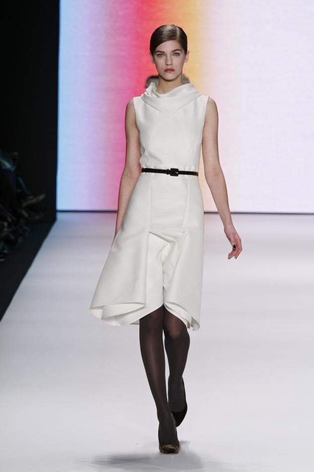 19. Sam: Bone silk and wool organdy dress and black velvet belt.