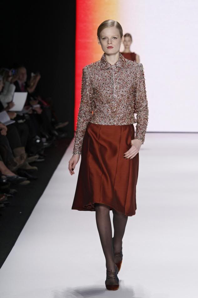 25. Hanne: Rust and primrose embroidered jacket, rust silk and wool organdy wing skirt.