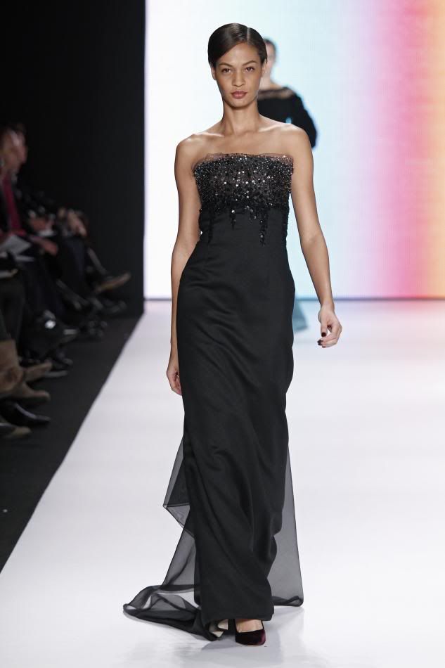 32. Joan:Black embroidered silk and wool organdy handkerchief strapless gown.